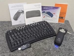 Gyration Set: Keyboard W Receiver, Cordless Optical Air Mouse & Charging Cradle. Fixed Price $50.00.