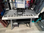 Yamaha Tyros 4 61-KEY Electronic Keyboard Silver W/ Stand, Speakers, Case, Box. Fixed Price $1550.00.